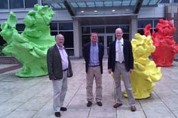 (L to R) Professor Victor Jongeel, Dr Roy Sleator and Dr Paul Walsh at the Genomics Institute of University of Illinois at Champagne Urbana. The green, yellow and red sculptures represent the resolved three dimensional structures of the ribosomes representing the three domains of life: Eukaryota, Bacteria and Achaea (a new kingdom of life defined by Carl Woose in 1977 – Woose is currently professor of microbiology at the University of Illinois at Urbana-Champaign).